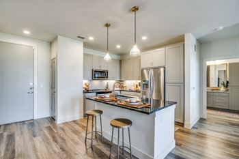 Aura avant apartments in lewisville, texas model kitchen with island
